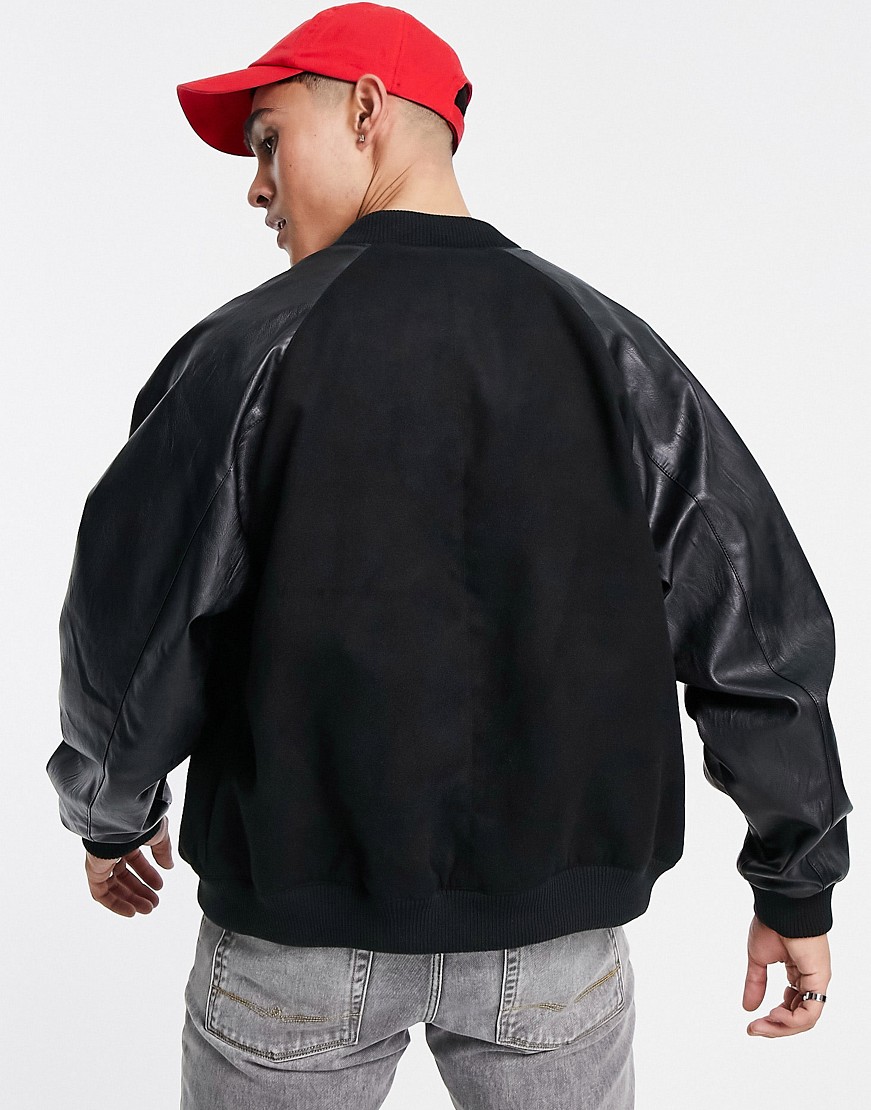 Czarna-kurtka-bomberka-oversize-z-naszywkami-defekt-S-1 Czarna-kurtka-bomberka-oversize-z-naszywkami-defekt-S