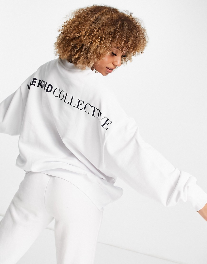 Damska-biala-bluza-oversize-z-logo-na-plecach-XS-1 Damska-biala-bluza-oversize-z-logo-na-plecach-XS