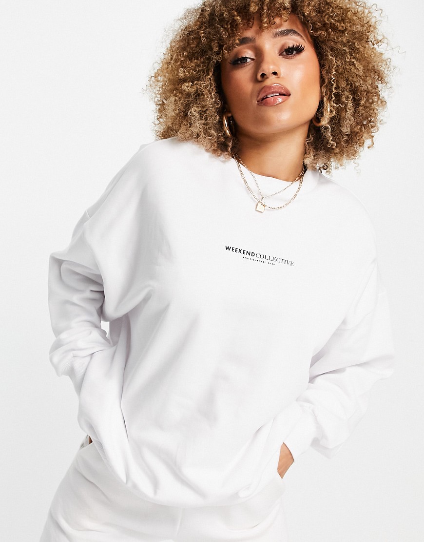Damska-biala-bluza-oversize-z-logo-na-plecach-XS-2 Damska-biala-bluza-oversize-z-logo-na-plecach-XS