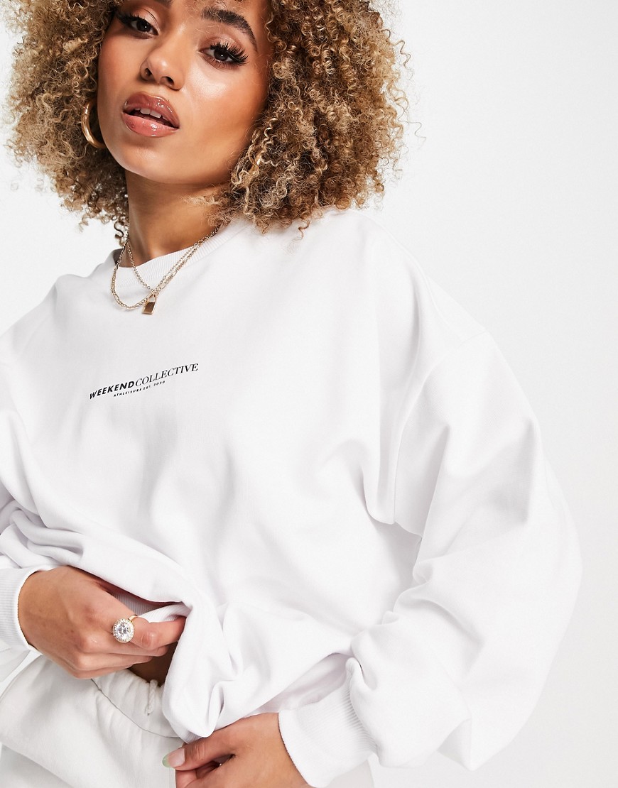 Damska-biala-bluza-oversize-z-logo-na-plecach-XS-3 Damska-biala-bluza-oversize-z-logo-na-plecach-XS
