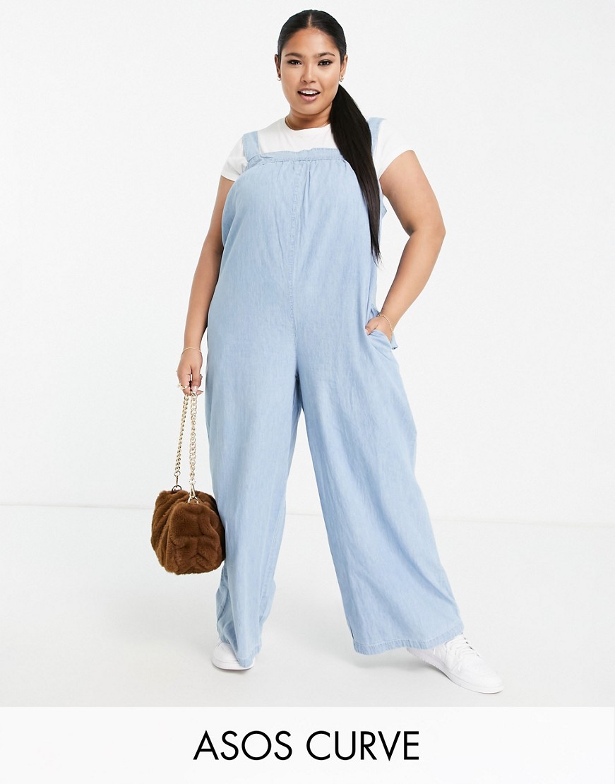Jasnoniebieski luźny kombinezon z miękkiego jeansu plus size 54 Jasnoniebieski-luzny-kombinezon-z-miekkiego-jeansu-plus-size-54