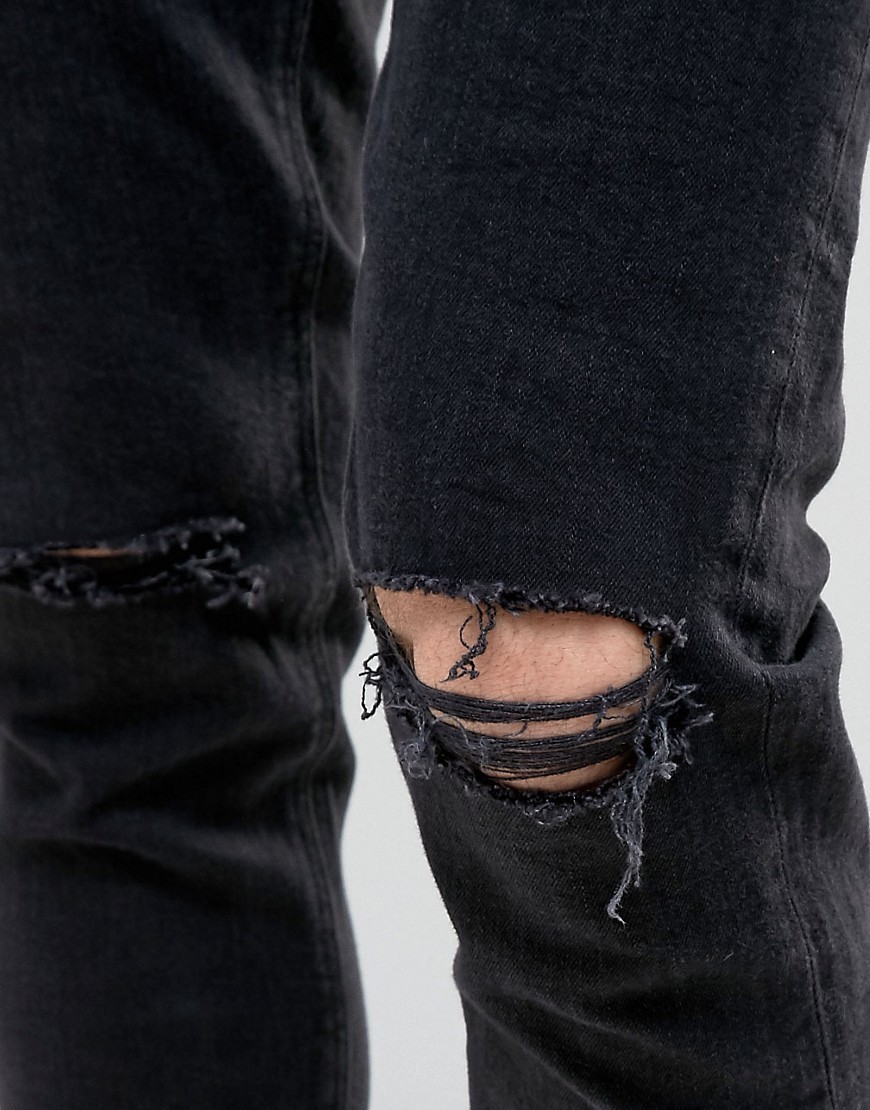 K19-Czarne-spodnie-jeansowe-skinny-z-dziurami-na-kolanach-W38-L32