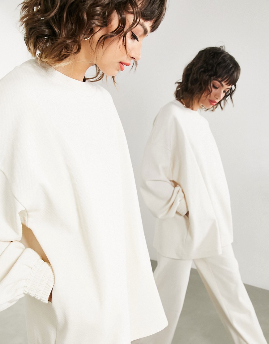 Kremowa bluza z teksturowanego dżerseju 44 Kremowa-bluza--z-teksturowanego-dzerseju-44