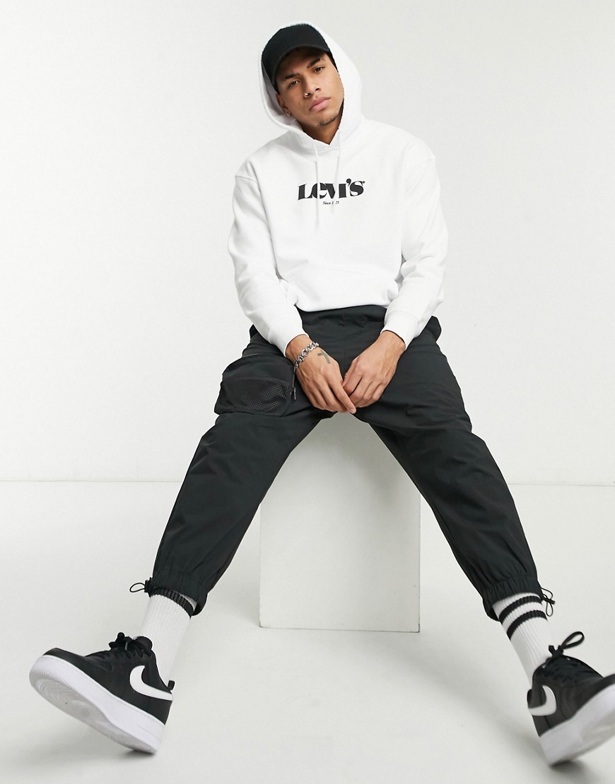 Levis-biala-meska-bluza-o-luznym-kroju-z-duzym-logo-w-stylu-vintage-degekt-L-3 Levis-biala-meska-bluza-o-luznym-kroju-z-duzym-logo-w-stylu-vintage-degekt-L