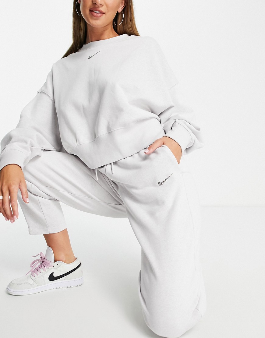 Nike-Lounge-jasnoszare-damskie-melanzowe-spodnie-dresowe-logo-XS-1 Nike-Lounge-jasnoszare-damskie-melanzowe-spodnie-dresowe-logo-XS