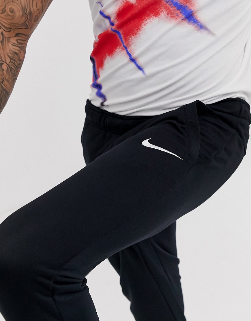 Nike-czarne-Spodnie-dresowe-zwezane-uzywane-defekt-L
