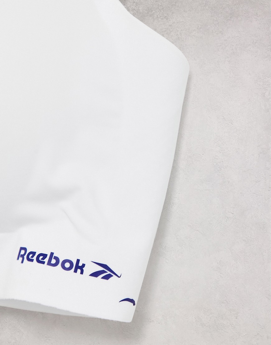 Reebok-bialy-biustonosz-sportowy-ze-skrzyzowanymi-na-plecach-paskami-S-2 Reebok-bialy-biustonosz-sportowy-ze-skrzyzowanymi-na-plecach-paskami-S