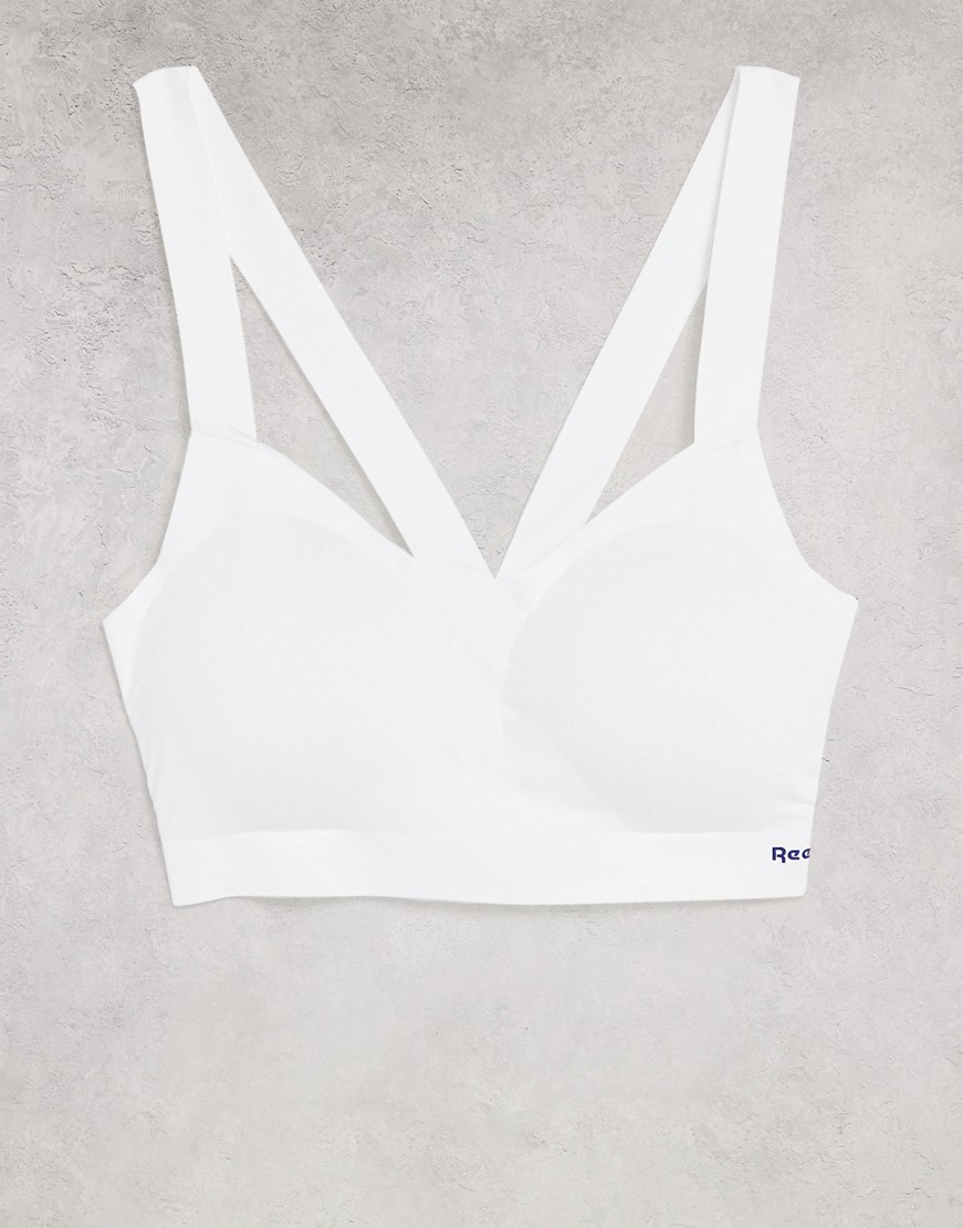 Reebok biały biustonosz sportowy ze skrzyżowanymi na plecach paskami S Reebok-bialy-biustonosz-sportowy-ze-skrzyzowanymi-na-plecach-paskami-S
